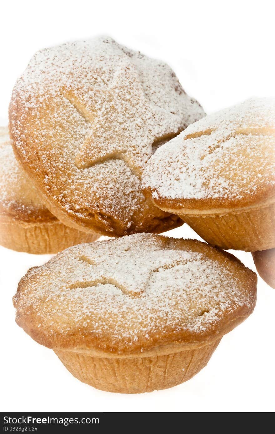 Close up of mince pies with icing sugar dusting on white isolated background