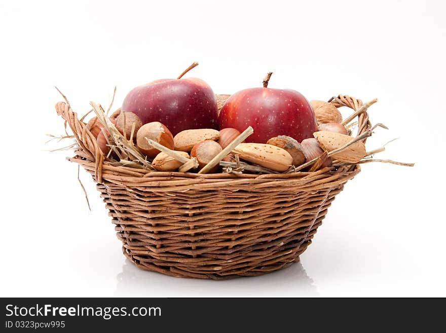 Nuts and apples in a basket