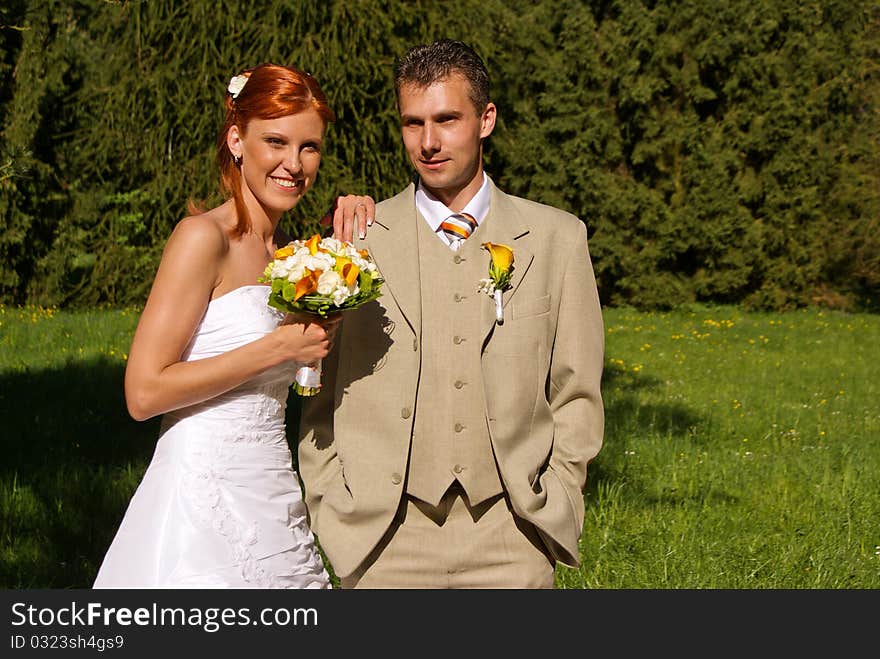 Bride offers her bouquet. Camera lens is focused on the flowers. Bride offers her bouquet. Camera lens is focused on the flowers