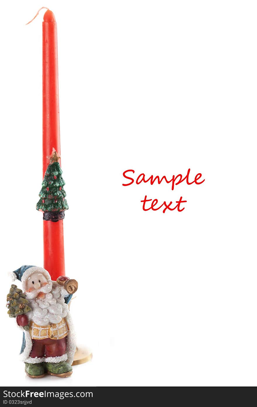 Christmas candle behind ceramic santa claus decoration. Christmas candle behind ceramic santa claus decoration