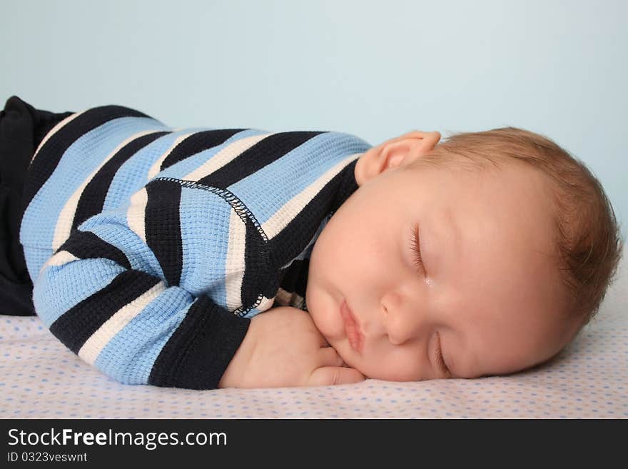 Two month old baby boy on a dotted blanket. Two month old baby boy on a dotted blanket