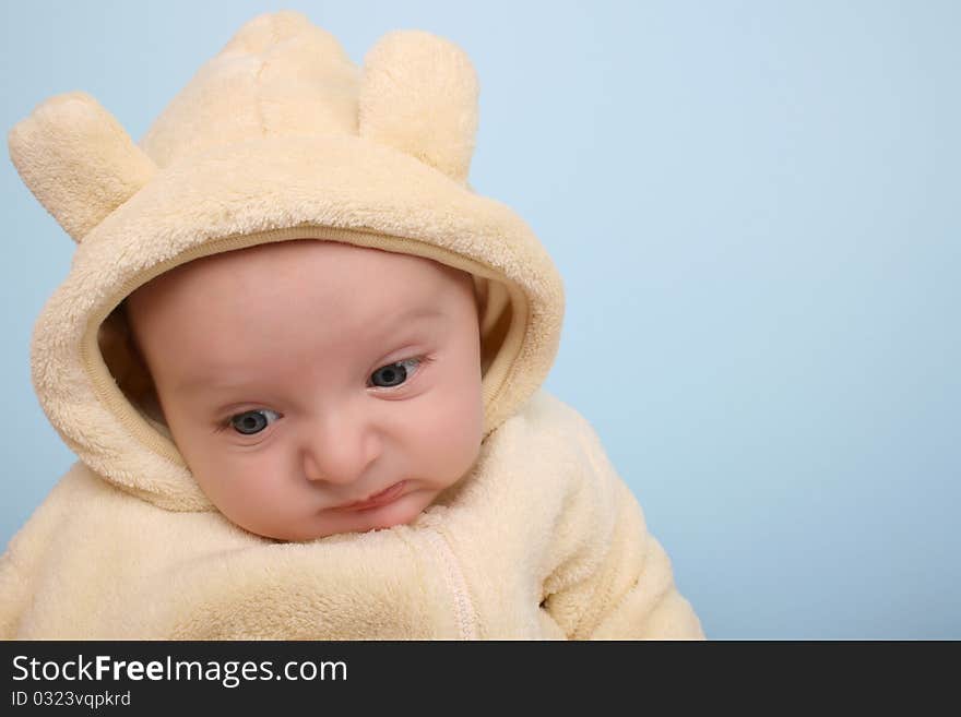 Two month old baby boy wearing a soft animal suit