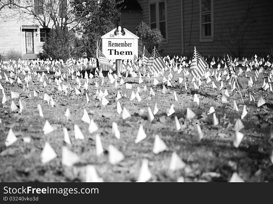 Flags and Remember Them sign. Flags and Remember Them sign