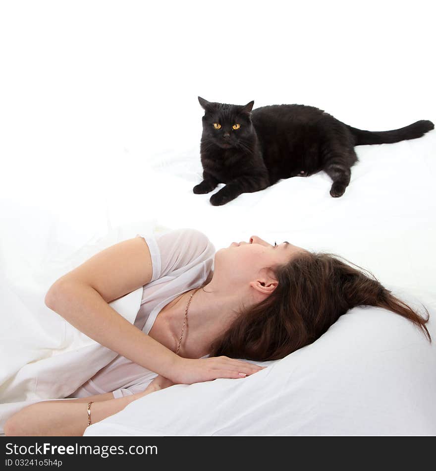 Woman in a bed with her black cat. Woman in a bed with her black cat