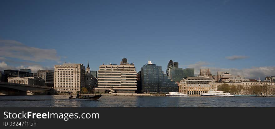 Modern buildings in london with clouds