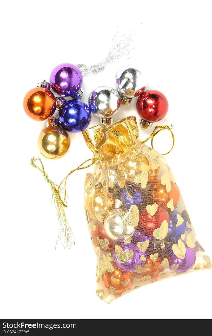 Christmas colorful balls in golden bag, on white. Christmas colorful balls in golden bag, on white