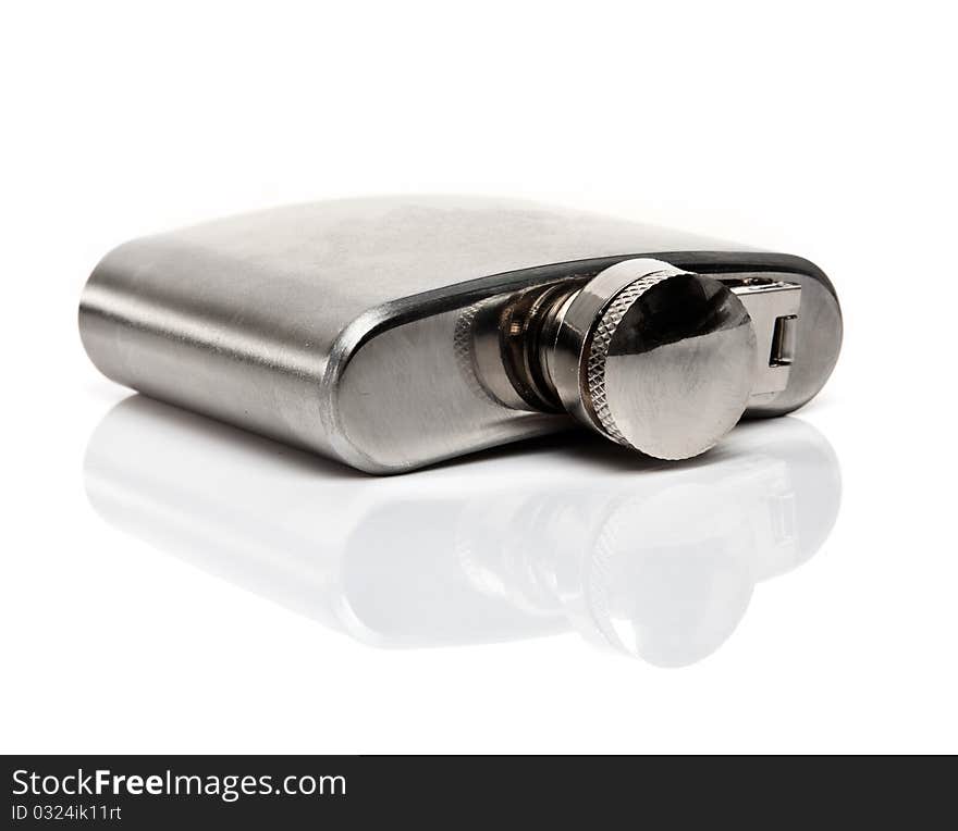 Flask of brandy isolated over a white background