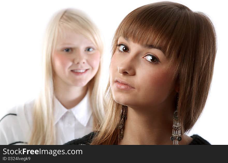 Portrait two girls small depth to sharpnesses on white background