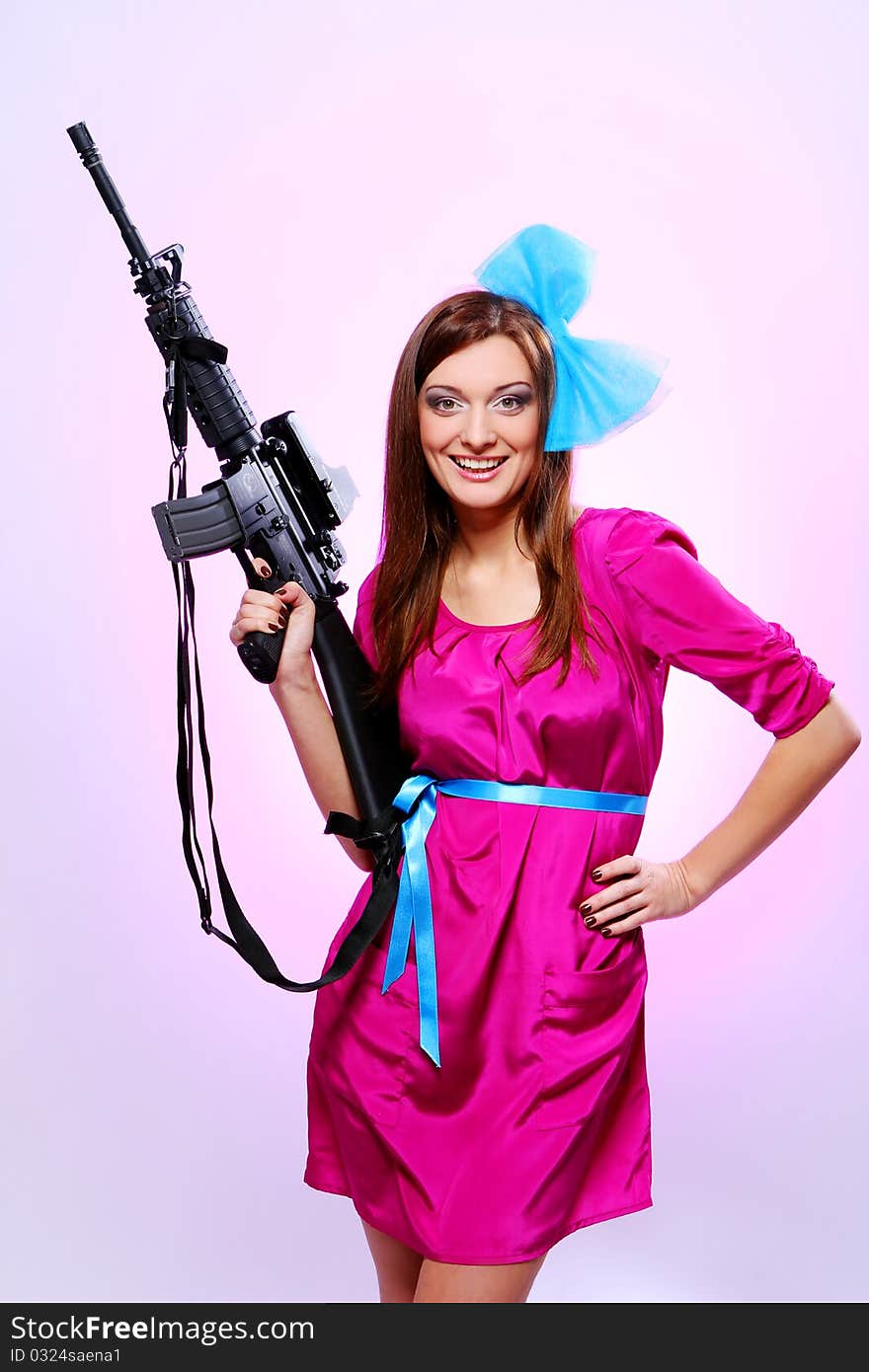 Attractive and sexy spy woman with assault rifle