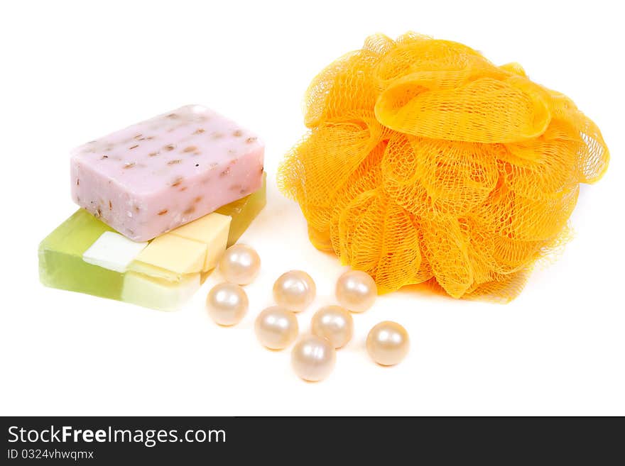 Green, purple and yellow fruit soap washcloth on white background