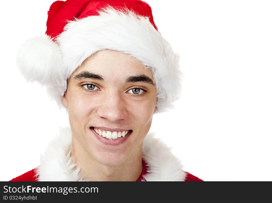 Attractive male teenager dressed as santa claus smiles happy. Isolated on white background. Attractive male teenager dressed as santa claus smiles happy. Isolated on white background.