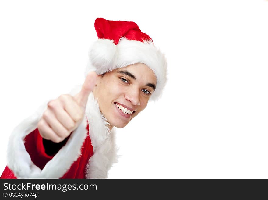 Smiling male santa claus teenager shows thumb up. Isolated on white background.