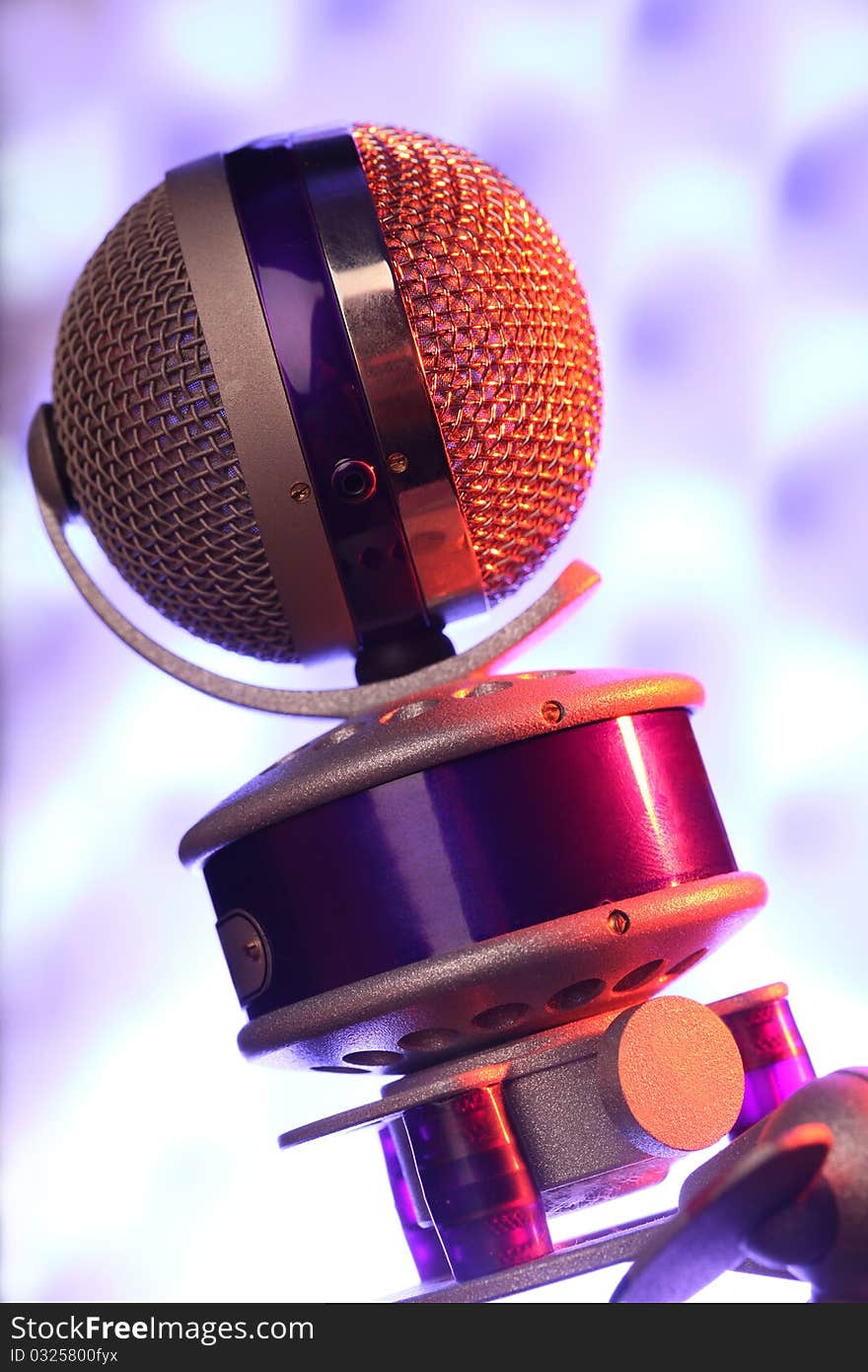 Modern violet microphone against sonic foam. Modern violet microphone against sonic foam