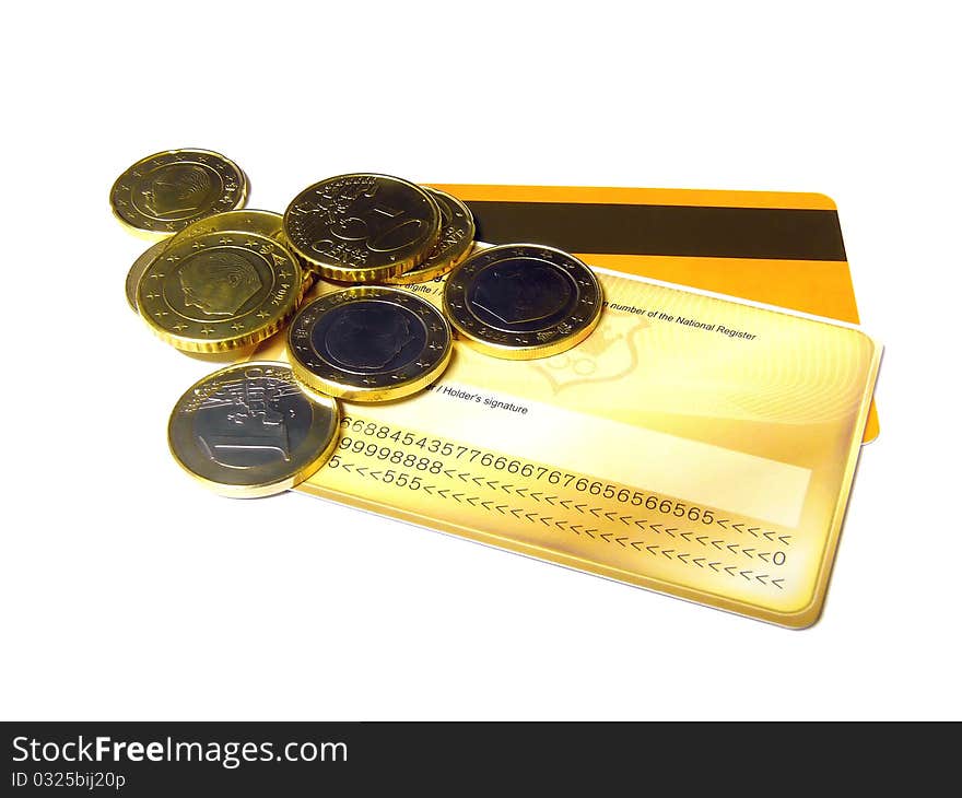 European coins lying on some credit cards isolated on a white background