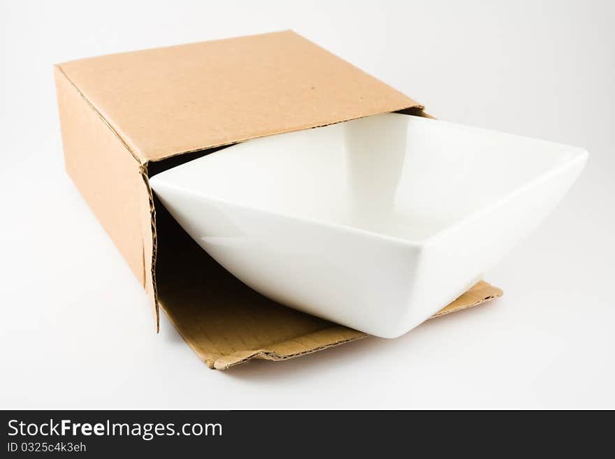 Dish in Cardboard Box isolated on a white background