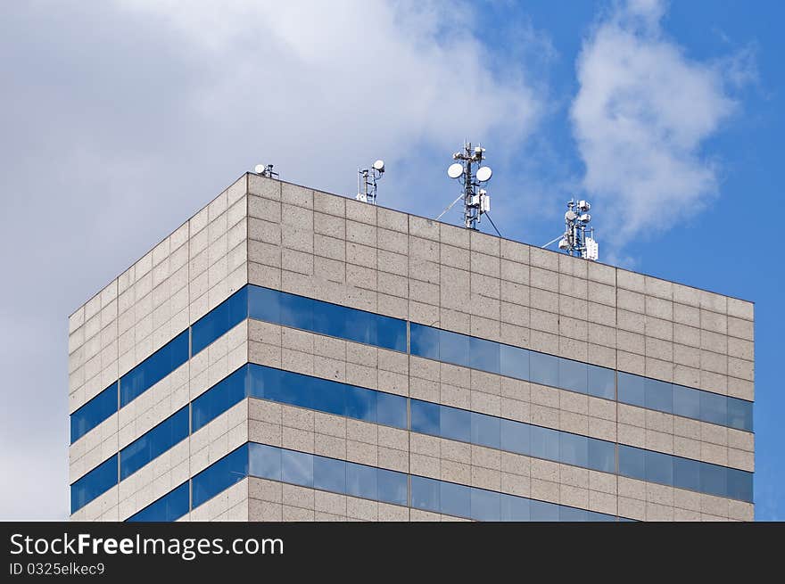 Antennas On A Rooftop Of A Modern Building.