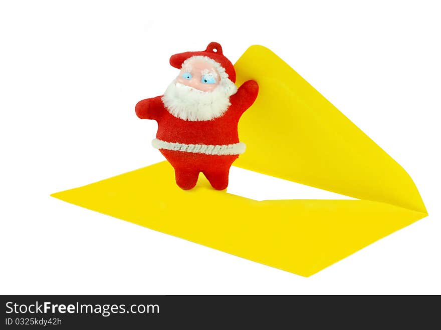 Santa Claus figurine opening a letter. Santa Claus figurine opening a letter