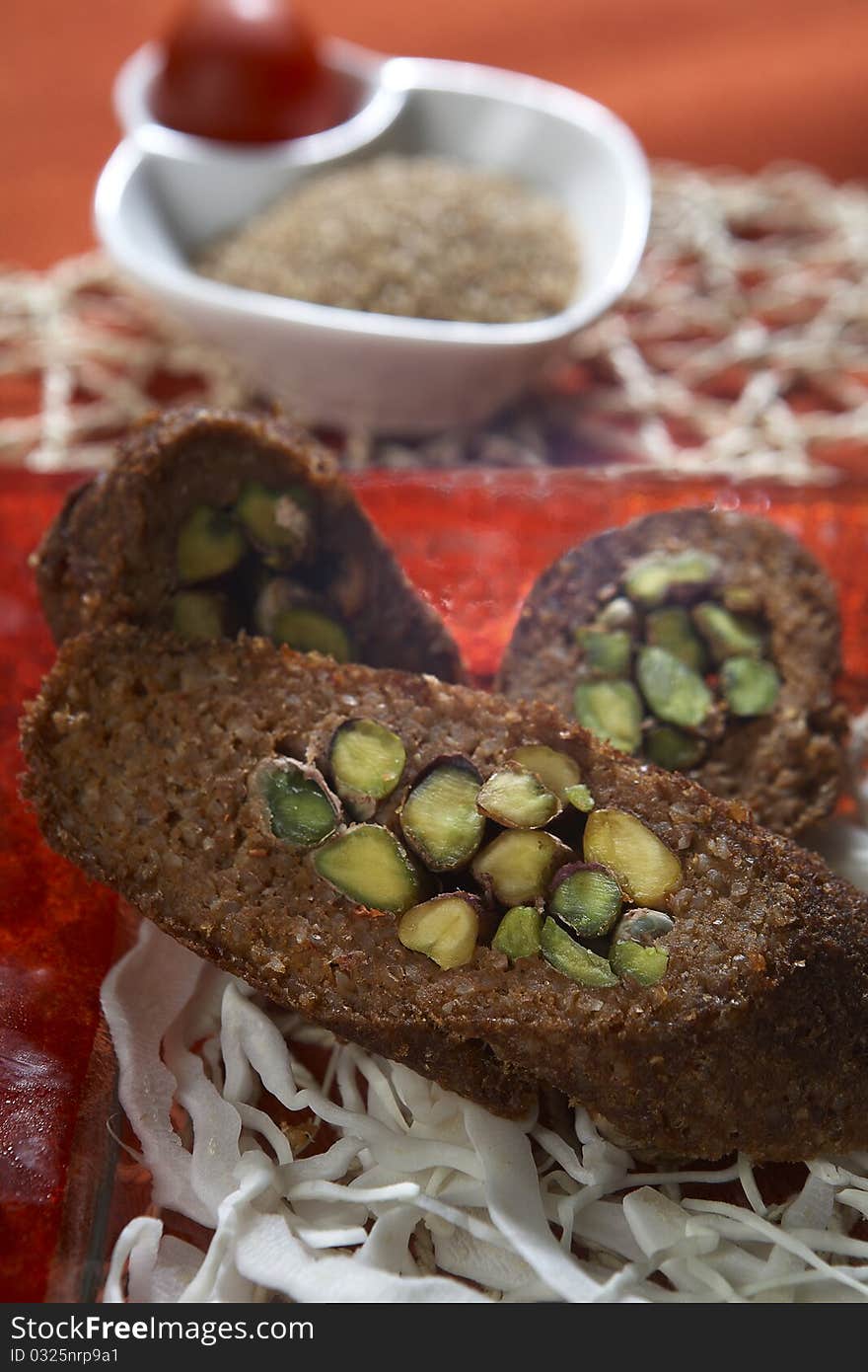 Rolled kibbeh with nuts