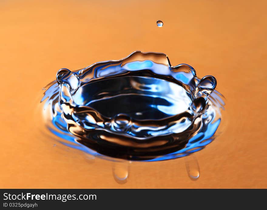 Blue water drop close up