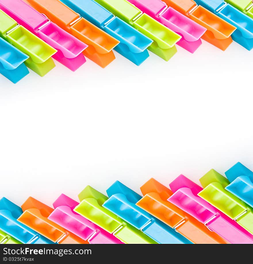 Close up shot of multicolored clothespins isolated on white