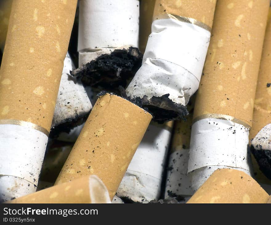 Closeup of several cigarette butts