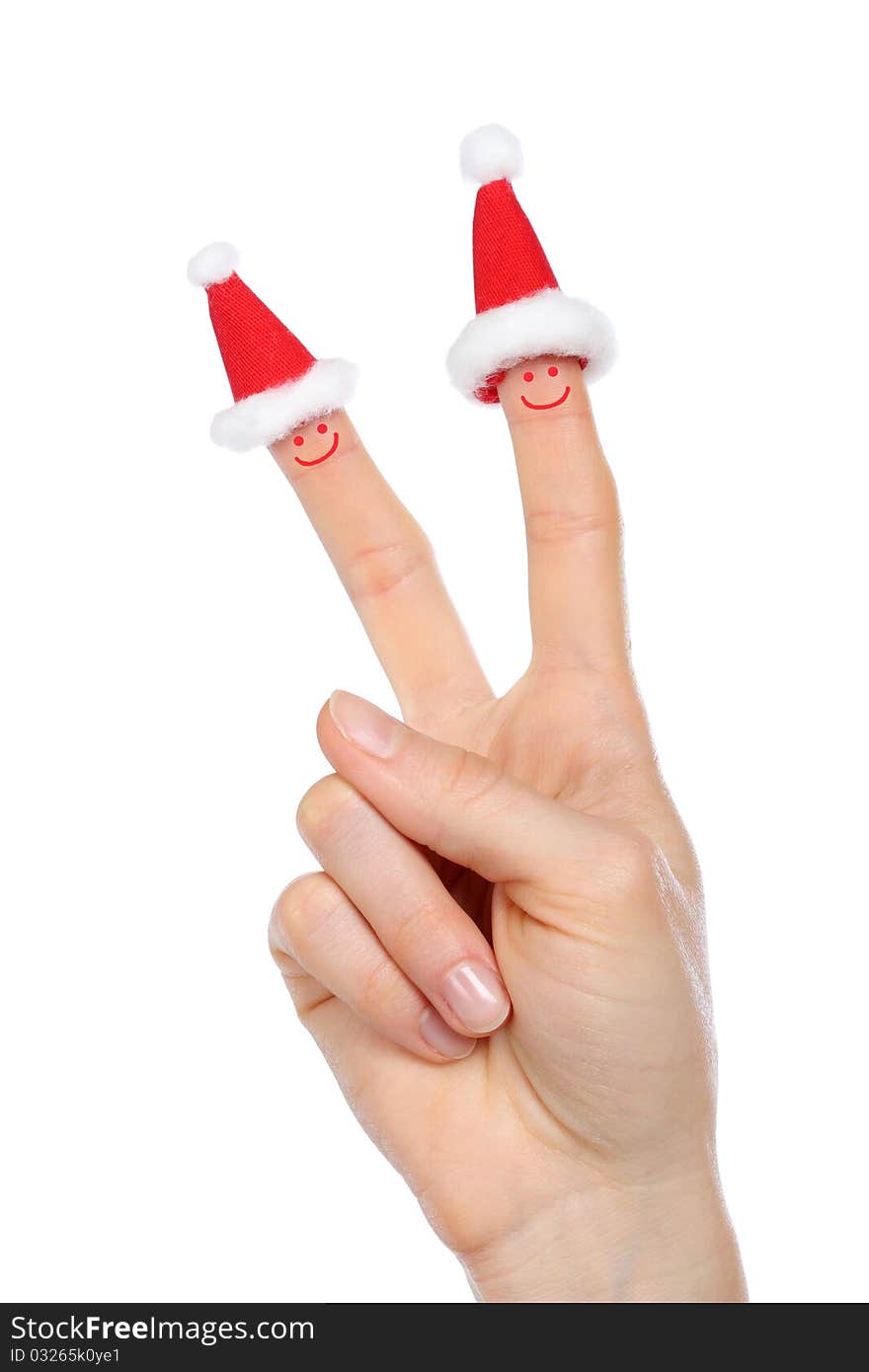 Hand with small Santas caps and smiles