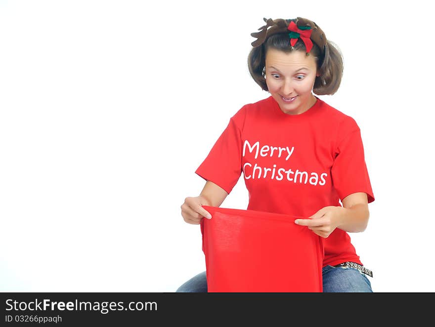 Young woman looks into a Santa s Bag