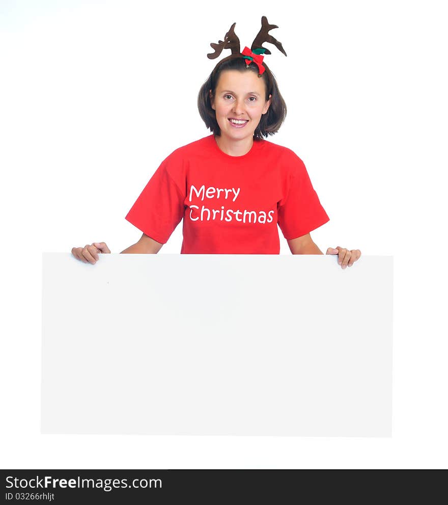 Isolated happy christmas woman looking at a blank sign