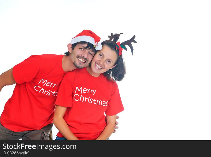 Isolated happy christmas couple in the santa hats. Isolated happy christmas couple in the santa hats