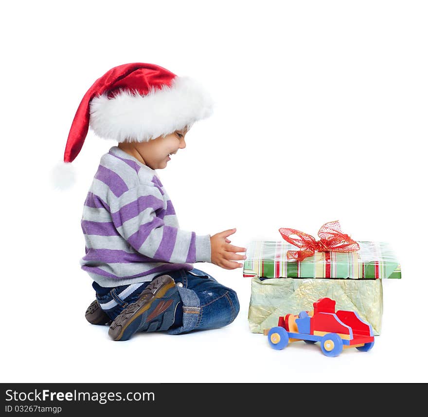 Isolated studio shot of funny little boy wearing Santa’s hats. Isolated studio shot of funny little boy wearing Santa’s hats