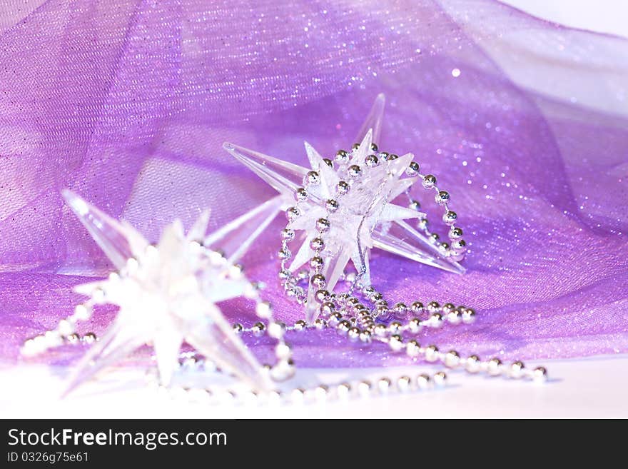 Holiday stars on violet background