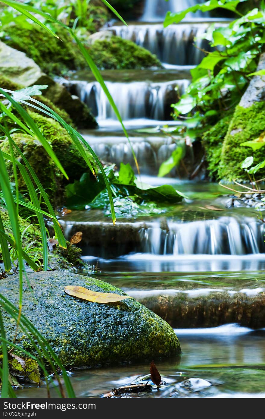 Beautiful veil cascading waterfalls, mossy rocks