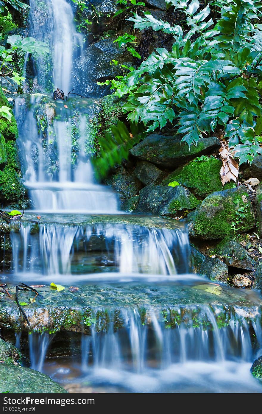 Beautiful veil cascading waterfalls, mossy rocks