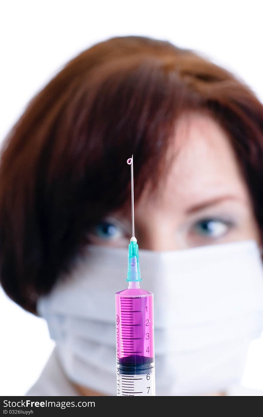 Doctor with a syringe isolated on white