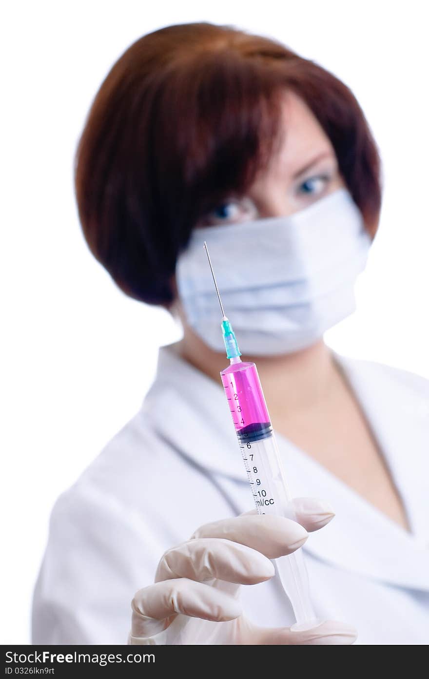 Doctor with a syringe isolated on white