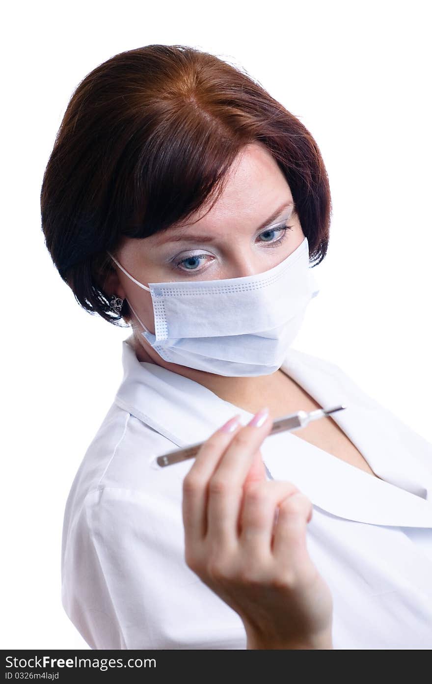 Nurse looks at thermometer isolated on white