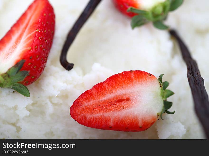 Strawberries and vanilla closeup in white