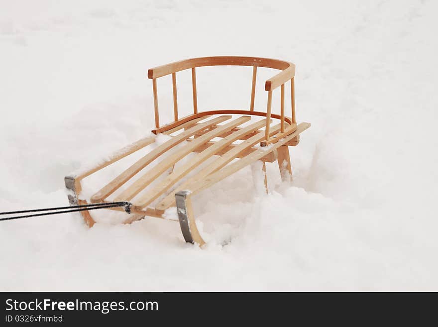 Wooden sled on the snow. Winter 2010. Wooden sled on the snow. Winter 2010