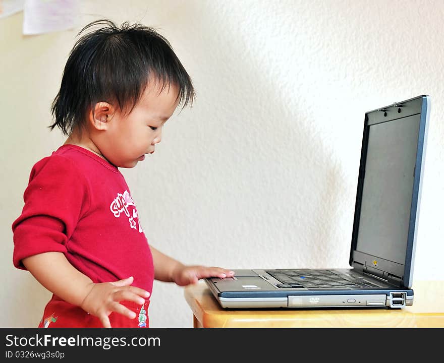 A little asia girl with laptop