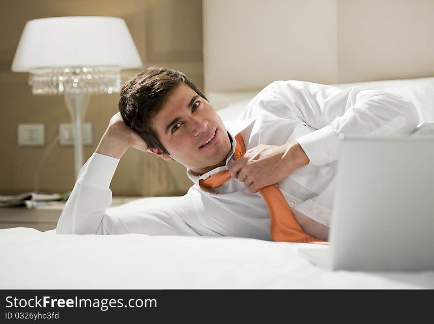 Relaxed businessman in a room hotel