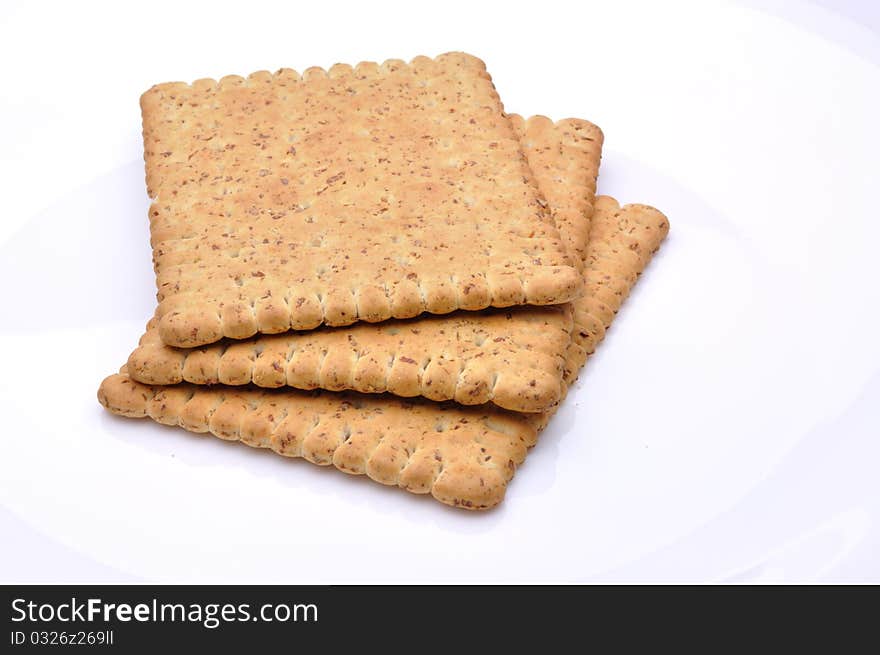 tasty biscuits on white plate