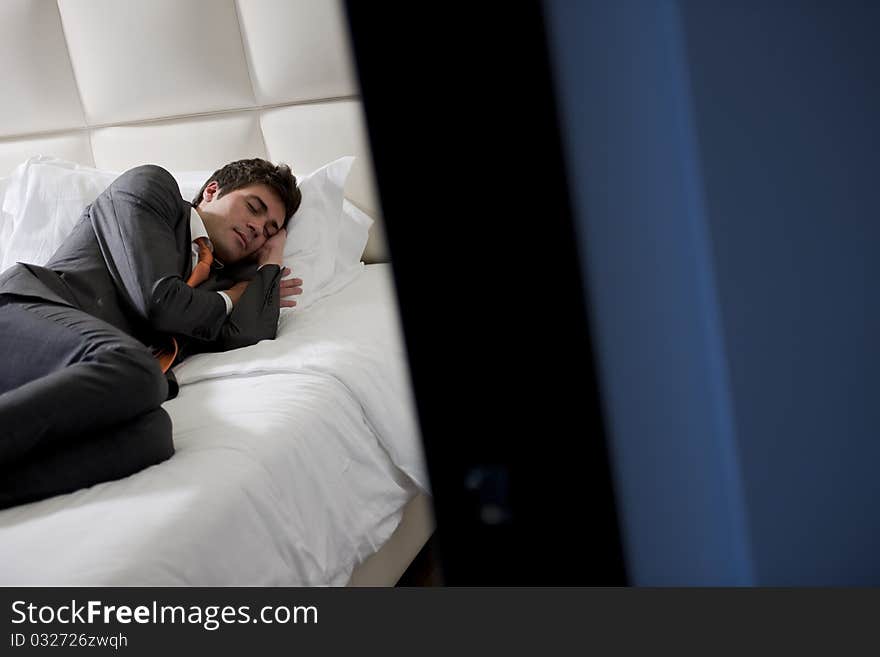 Businessman Asleep In Bedroom