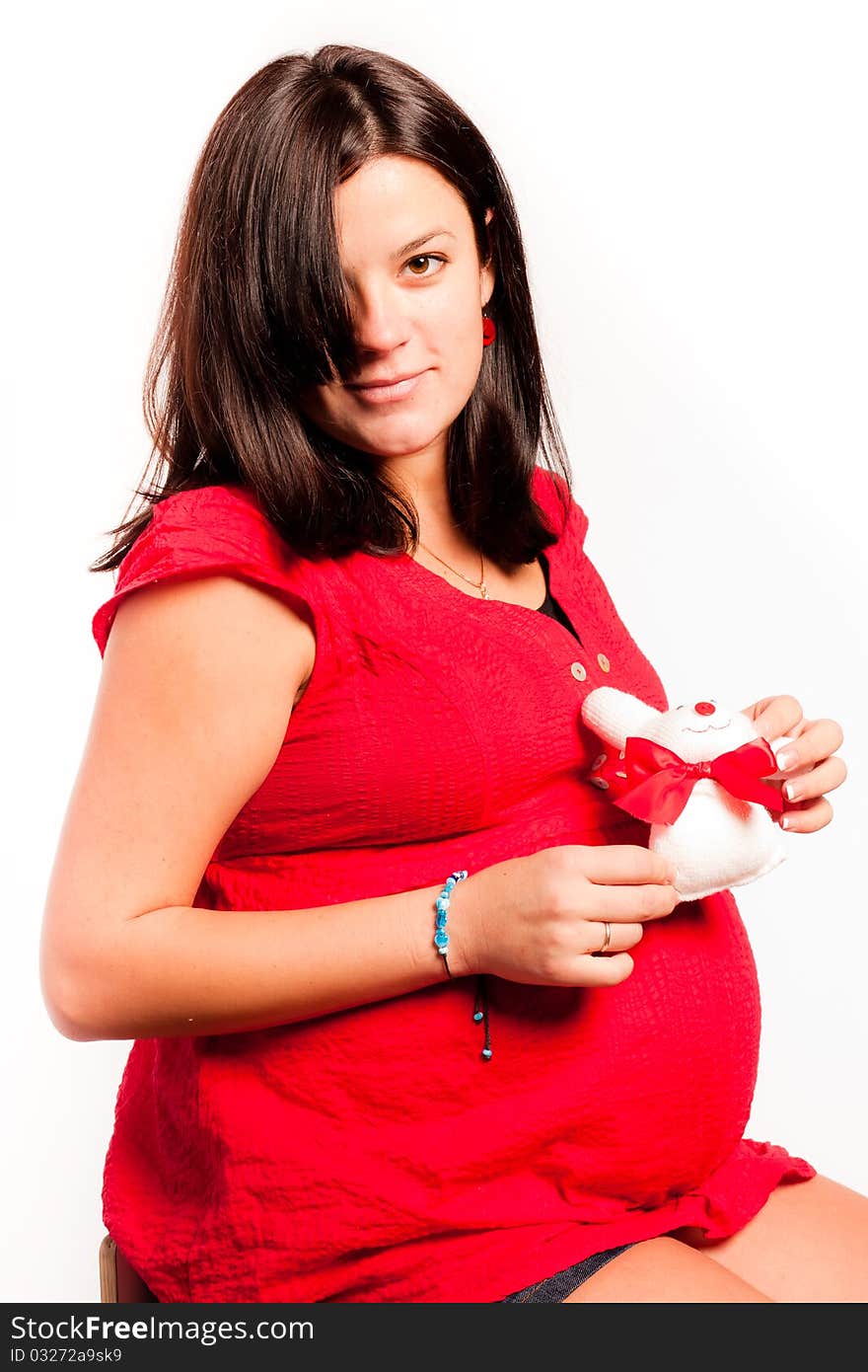 Beautiful pregnant woman staing on light grey background