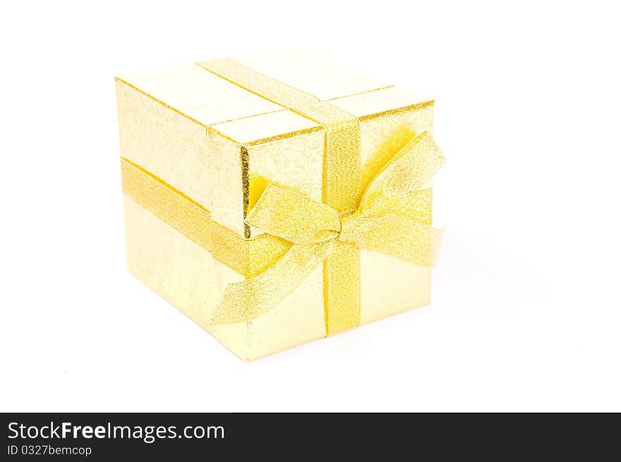 Christmas giftbox on white background, with golden ribbon