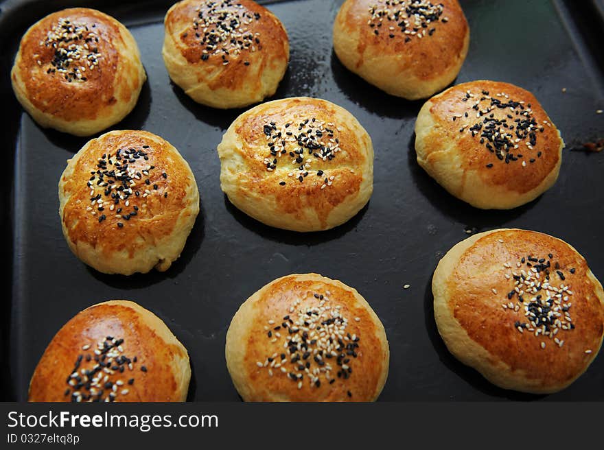 Row of freshly baked homemade buns. Row of freshly baked homemade buns.