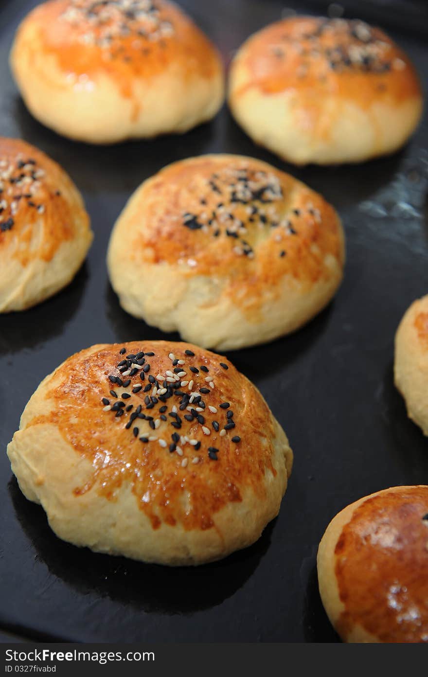 Row of freshly baked homemade buns. Row of freshly baked homemade buns.