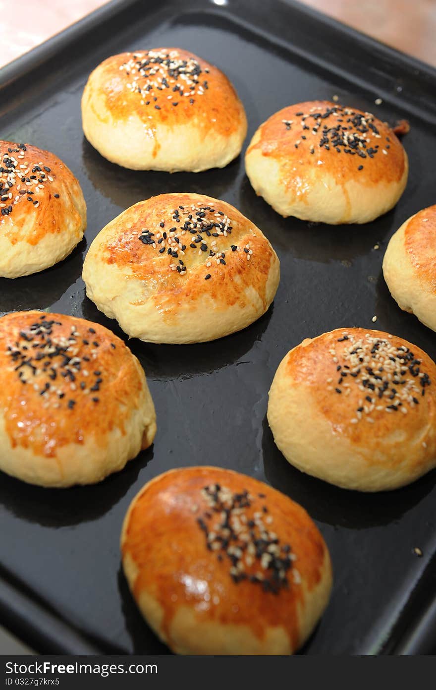 Row of freshly baked homemade buns. Row of freshly baked homemade buns.