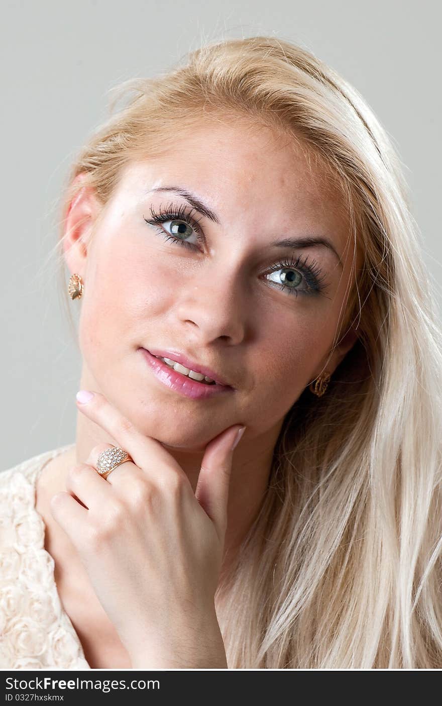 Young woman thinking and looking up