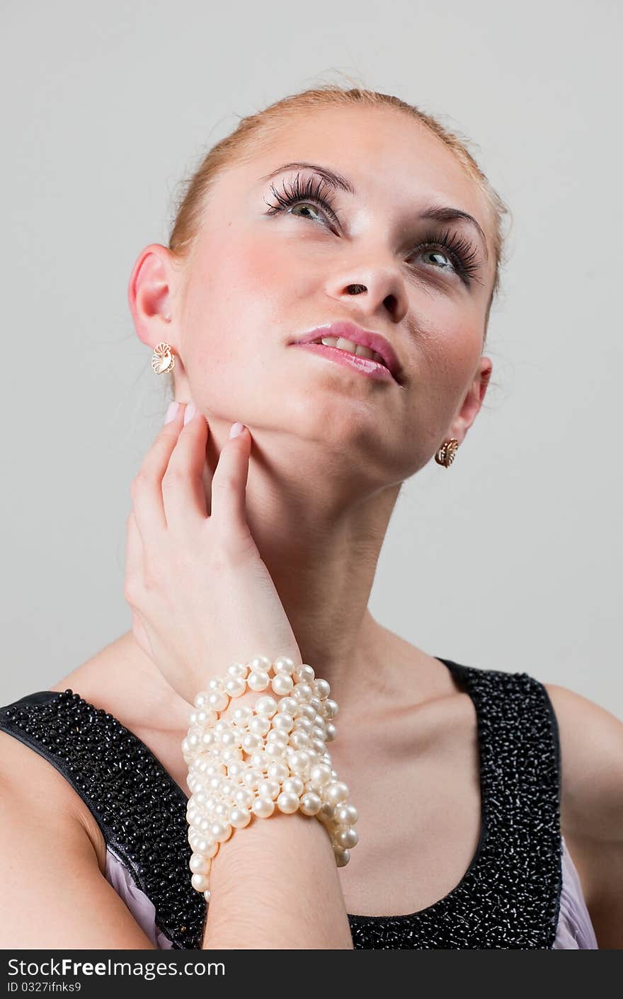 Young woman thinking and looking up