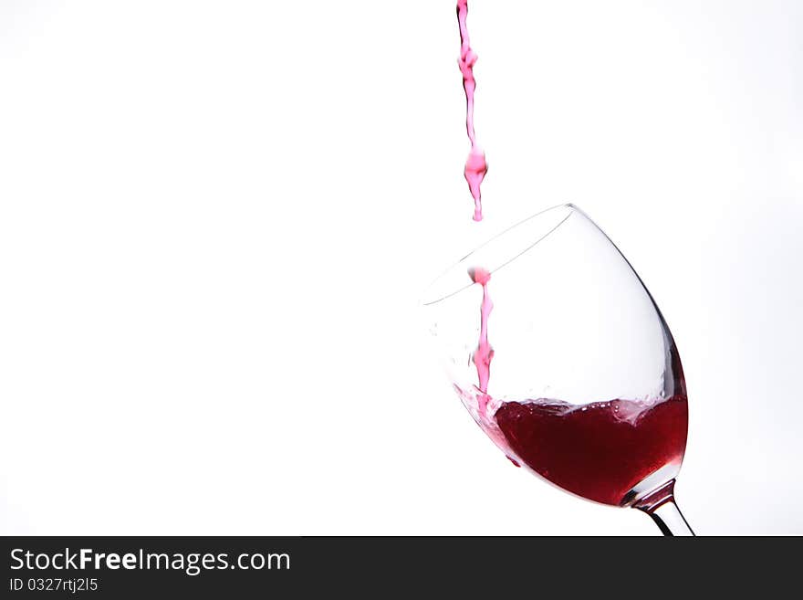 Full glass of red wine isolated on white background